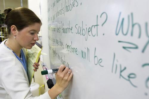 teacher-writing-on-whiteboard_1707088837.jpg