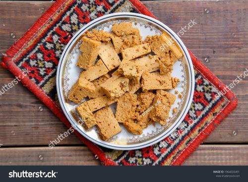 stock-photo-traditional-oriental-sweet-dessert-irimshik-sweet-curd-in-a-plate-on-a-wooden-background-1964033491_1769489353.jpg
